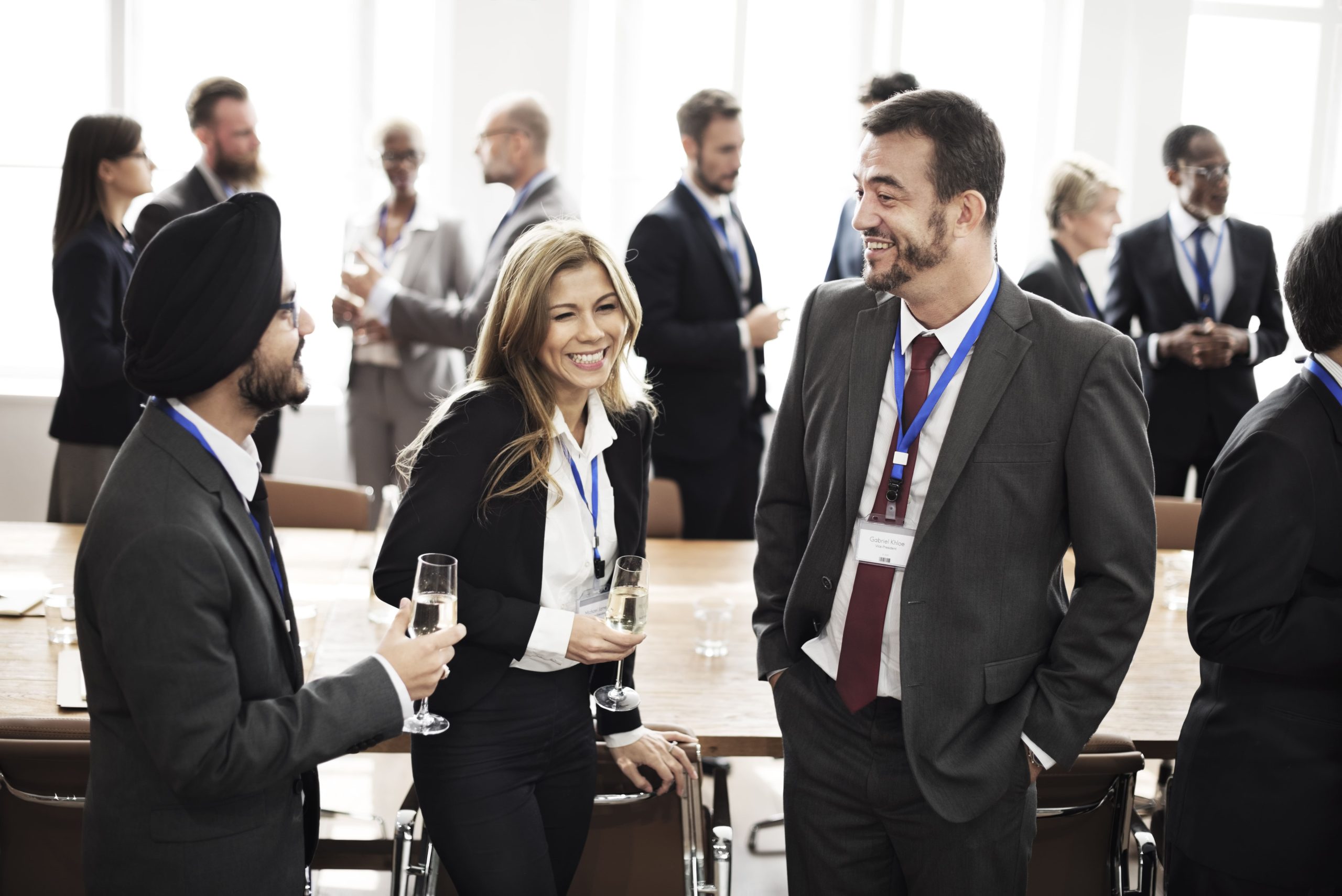 Business professionals networking and discussing at an industry conference